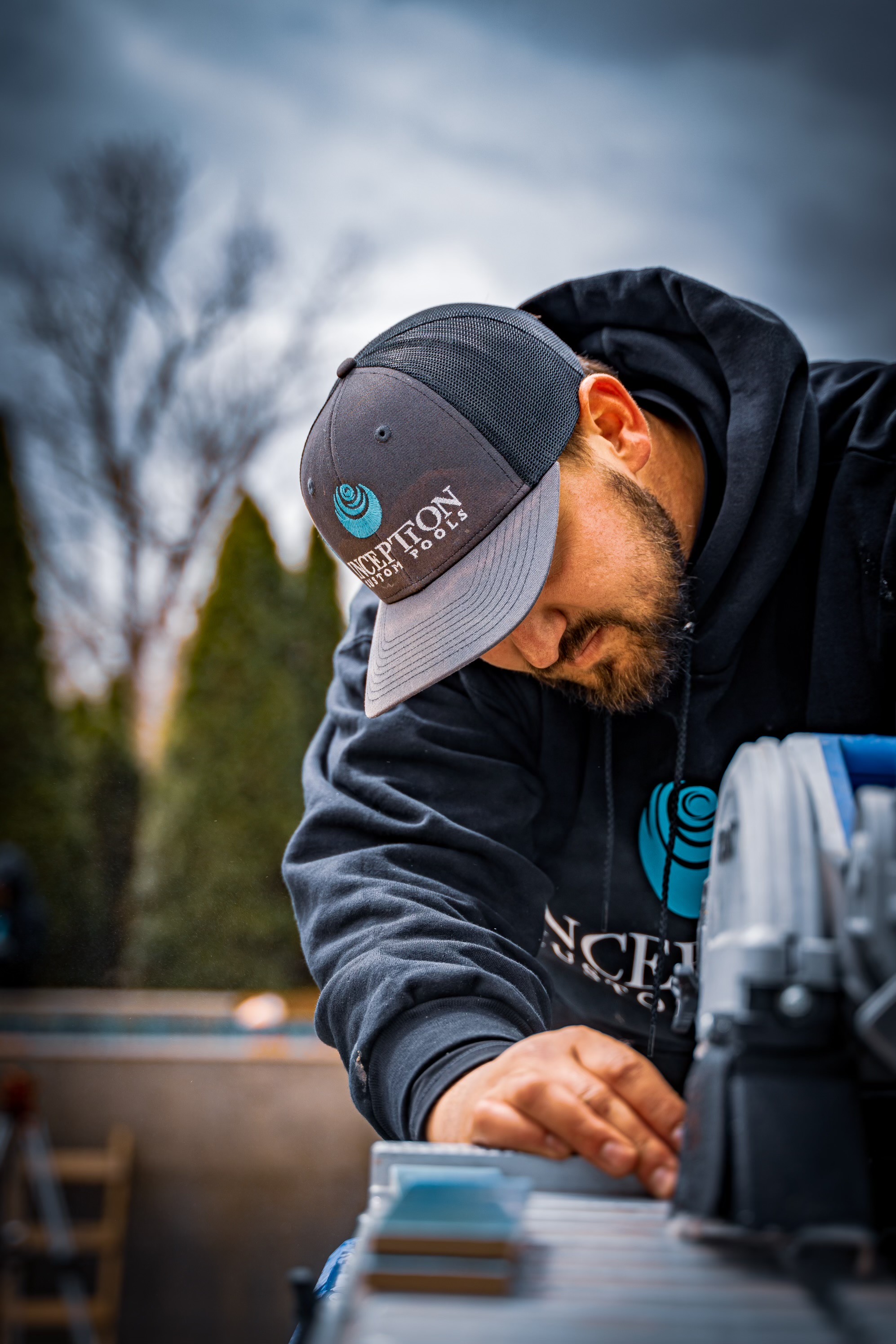 Nate Rothchild working on a pool installation - Inception Pools team